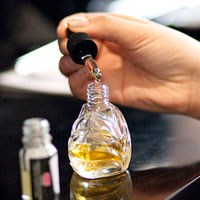 make a perfume adding drops of perfume ingredients